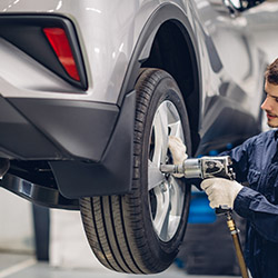 Auto car repair service center. Mechanic at work