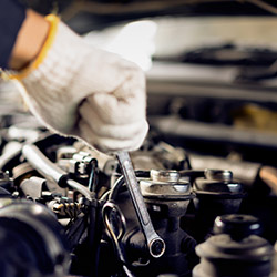 Auto car repair service center. Mechanic at work