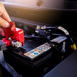 Automobile computer diagnosis. Car mechanic repairer looks for engine failure on diagnostics equipment in vehicle service workshop