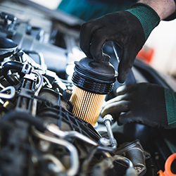 Automobile computer diagnosis. Car mechanic repairer looks for engine failure on diagnostics equipment in vehicle service workshop